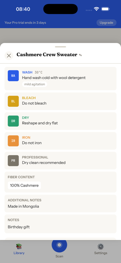 CareLabl showing decoded care instructions: hand wash cold, do not bleach, reshape and dry flat